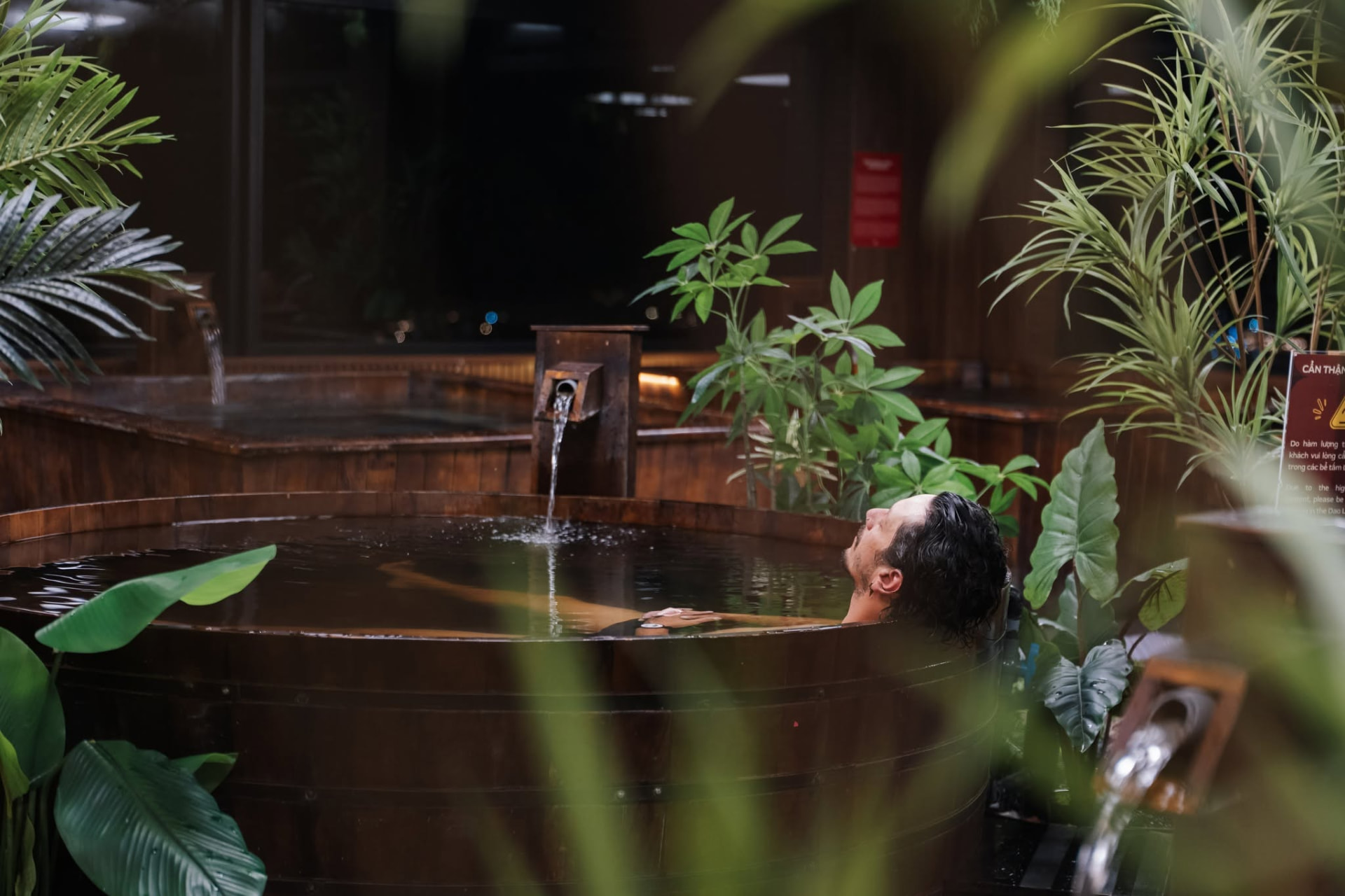 Warm thermal spring bath surrounded by forest in the mountains of Da Nang